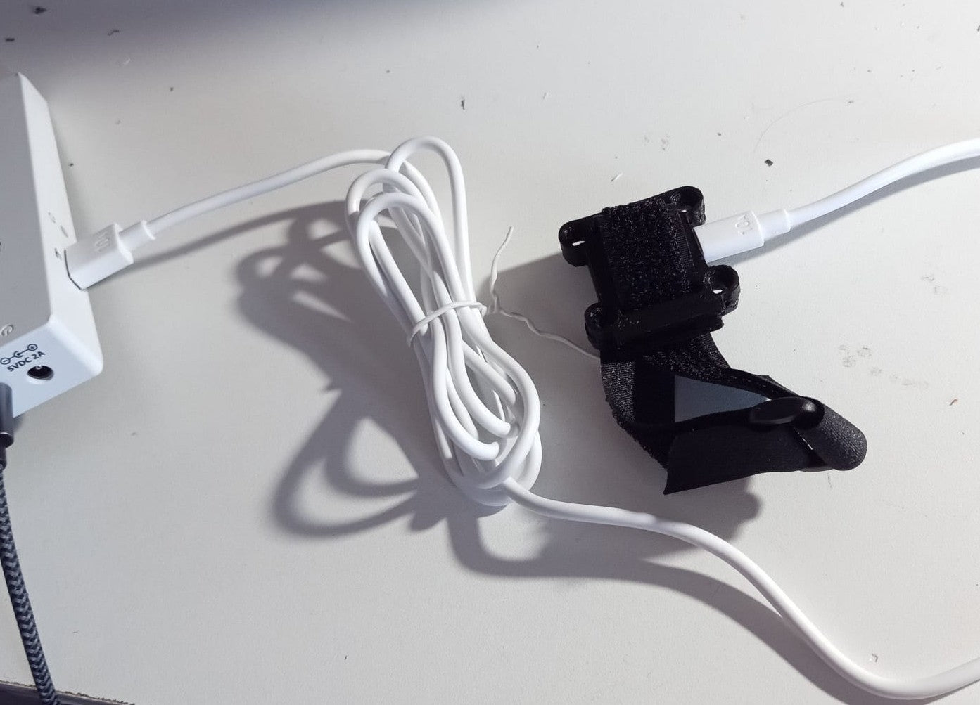The enclosure, strap and USB cable.